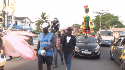 Larger-than-life human puppets.