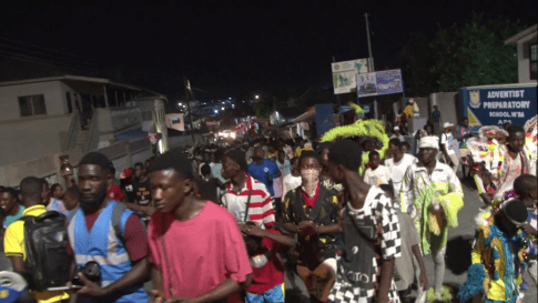 Winneba community participating in the street parade after dark