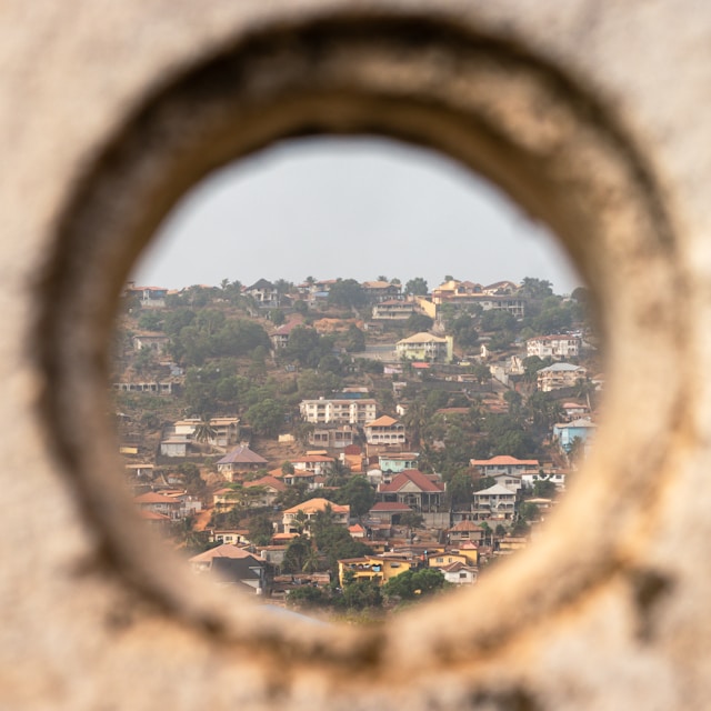 A view of Freetown through a round window