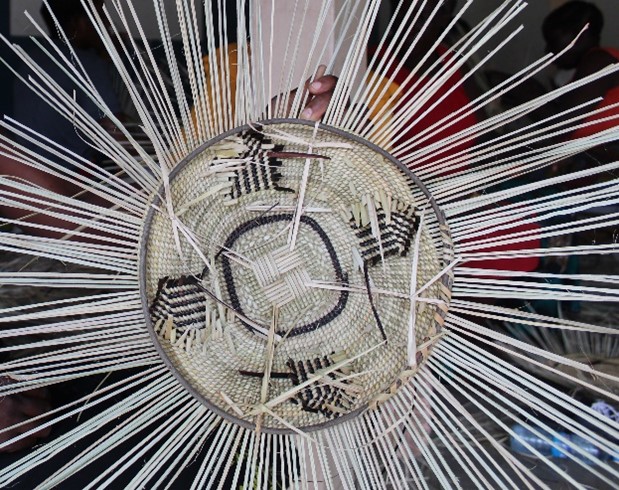 The pattern on a woven basket (work in progress) is a Tonga hut