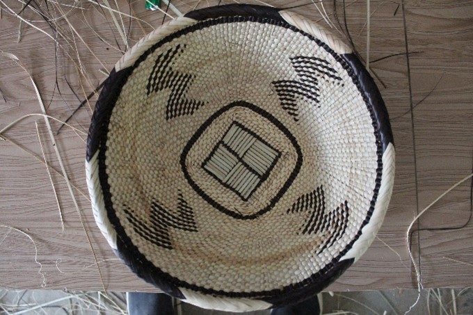 A woven Tonga basket with the pattern '3'
